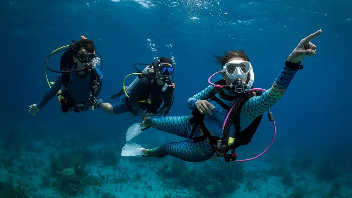 PADI Advanced Open Water Diver Course Advanced scuba divers exploring a Red Sea coral reef in Jeddah