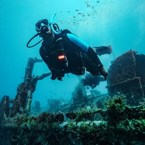 Scuba diver exploring a Red Sea shipwreck during PADI Advanced Open Water Diver Course